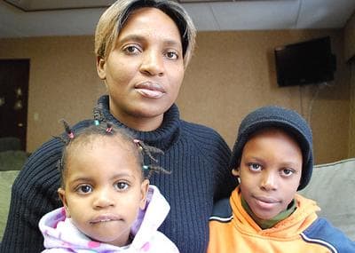 Marie Honore Milice and her children are homeless after coming to the Boston area following Haiti’s devastating Jan. 12 earthquake. The family is staying at a hotel in Woburn.  (Bianca Vazquez Toness/WBUR)