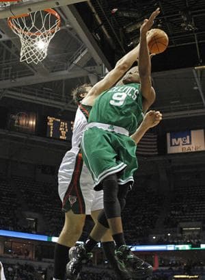 Milwaukee Bucks&#39; Andrew Bogut blocks the shot by the Boston Celtics&#39; Rajon Rondo during Tuesday&#39;s game in Milwaukee. (AP)