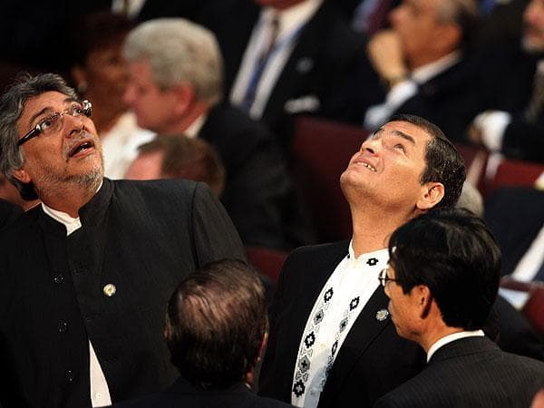 Paraguay&#39;s President Fernando Lugo, left, and Ecuador&#39;s President Rafael Correa react during an aftershock as Chile&#39;s President Sebastian Pinera was sworn into office in Valparaiso, Chile on Thursday. (AP)