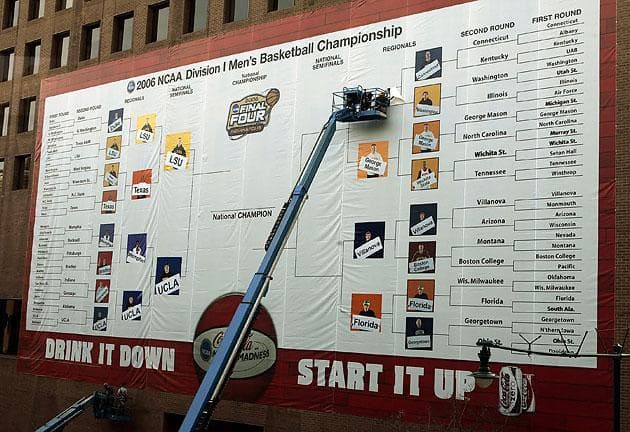 Construction workers filled out the Final Four bracket on the side of the Hyatt Regency building in Indianapolis on March 30, 2006. (Ann Heisenfelt/AP)