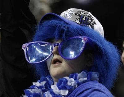 A Kentucky fan watches the championship game between Kentucky and Mississippi State at the NCAA college basketball Southeastern Conference tournament on Sunday, March 14, 2010, in Nashville, Tenn. (AP Photo/Wade Payne)