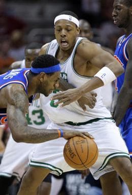 Boston Celtics&#39; Paul Pierce, center, runs into Cleveland Cavaliers&#39; J.J. Hickson, right, as he defends Cavaliers&#39; LeBron James, left, in the third quarter of an NBA basketball game Sunday, March 14, 2010, in Cleveland. The Cavaliers defeated the Celtics 104-93. (AP Photo/Mark Duncan)