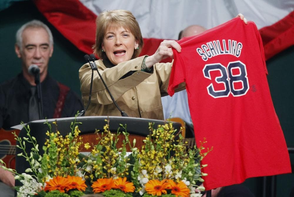 Massachusetts Attorney General Martha Coakley holds up a Red Sox jersey while speaking at the annual St. Patrick&#39;s Day breakfast in Boston on Sunday.  (AP)