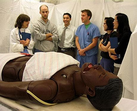 Medical workers at Children&#039;s Hospital in Boston participate in a simulation program to prepare them for the environment and injuries they will encounter in treating earthquake victims in Haiti. (Sacha Pfeiffer/Here &amp; Now)