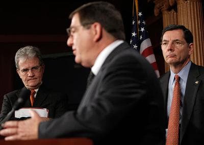 Sen. Tom Coburn, R-OK, left, and Sen. John Barrasso, R-WY, right, listen to Rep. Michael C. Burgess, R-Texas, during a news conference on health care with House GOP physicians in Washington on Thursday.(AP)