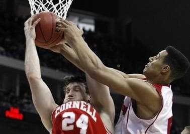 Cornell&#039;s Adam Wire (24) and Wisconsin&#039;s Ryan Evans fight over a rebound during the second half of an NCAA second-round college basketball game in Jacksonville, Fla. (AP)