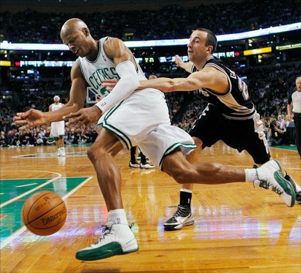 Boston Celtics' Ray Allen, left, drives past San Antonio Spurs' Manu Ginobili in the first quarter on Sunday. (Michael Dwyer/AP)