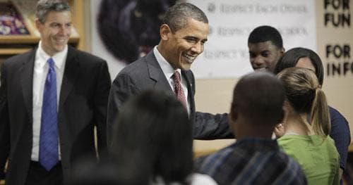 Education Secretary Arne Duncan looks on at left as President Barack Obama meets with students at Wright Middle School in Madison, Wis., Wednesday, Nov. 4, 2009. (AP)