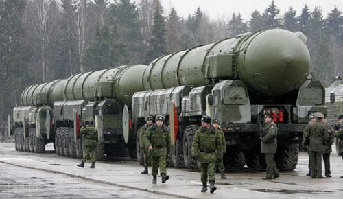 Russian troops are seen near truck-mounted Topol-M intercontinental ballistic missiles as they rehearse for the Victory Day parade in Moscow&#039;s Red Square, at a training field in the town of Alabino outside Moscow, Tuesday, March 18, 2008. (AP)