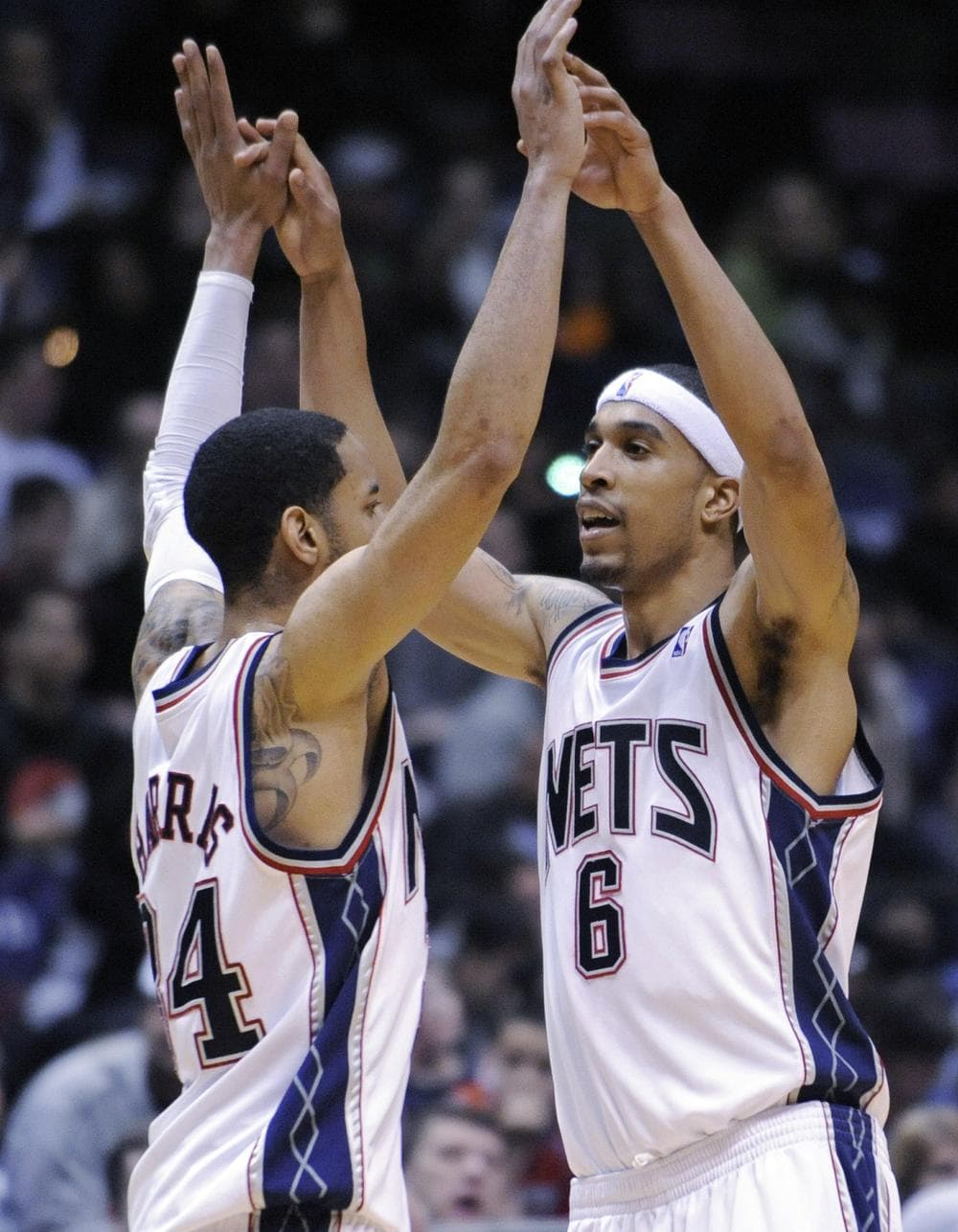 Devin Harris (l) and Courtney Lee celebrate the New Jersey Nets&#039; win over San Antonio Monday night. The win gave the Nets 10 on the season, one more than the worst NBA team ever. (AP Photo)
