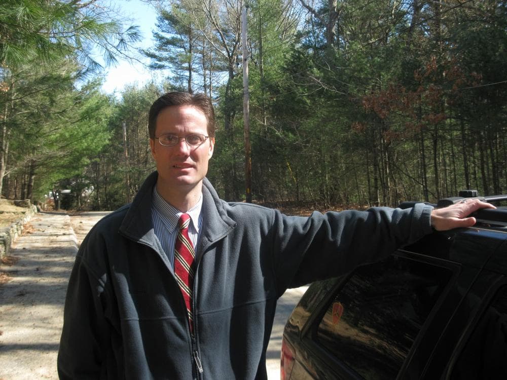 Ben Quelle campaigns in the woods of Plympton with his Jeep Cherokee. (Fred Thys/WBUR)