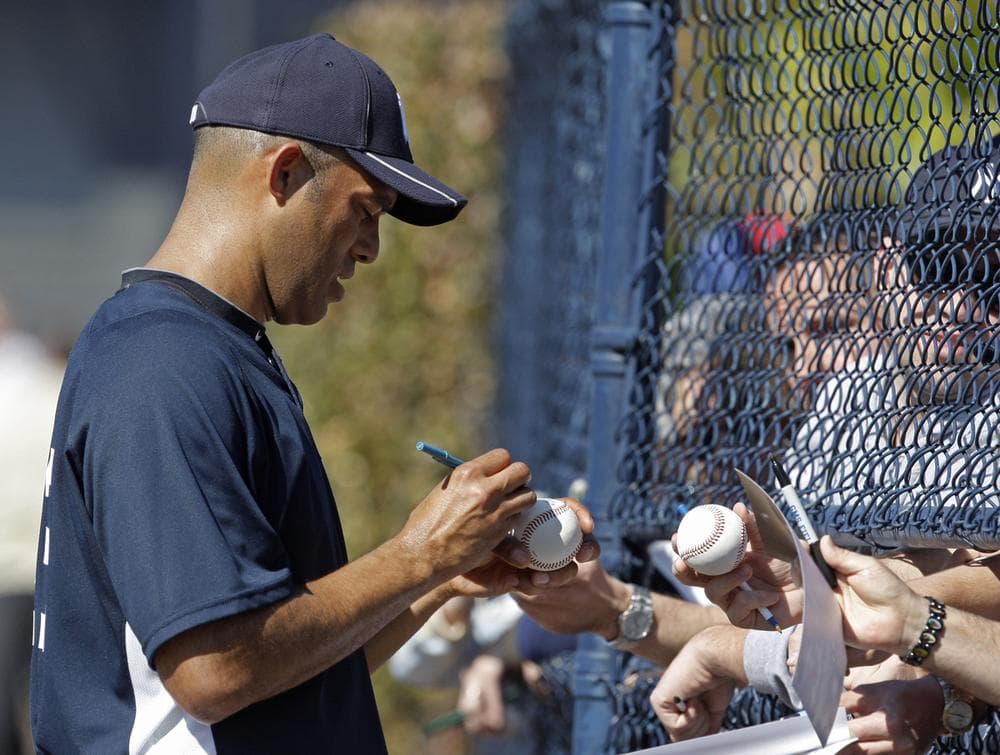 New York Yankees closer Mariano Rivera autographs baseballs for fans at Steinbrenner Field in Tampa, Fla., Monday, March 8, 2010. (AP File Photo)