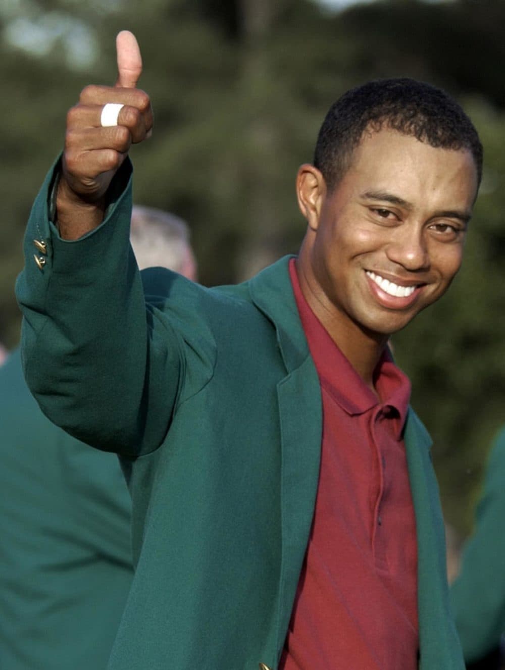 Tiger Woods celebrates after winning the Masters Tournament in Augusta, GA in 2002. (AP File Photo)