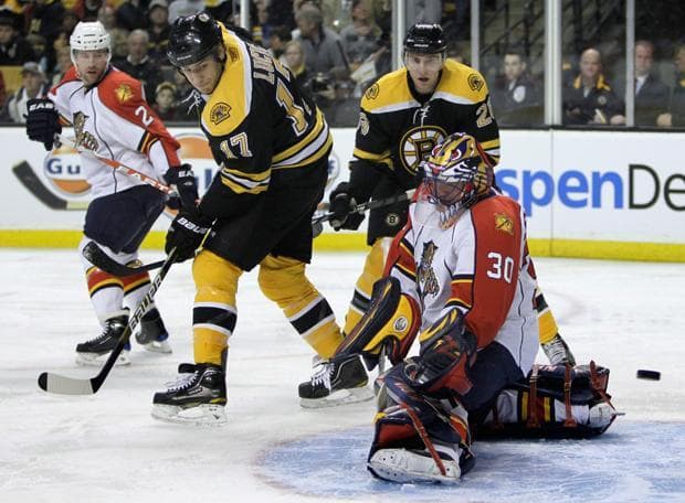 Florida goalie Scott Clemmensen makes a save on a shot tipped by Bruins left wing Milan Lucic (17) during a game on Thursday. (Charles Krupa/AP) 