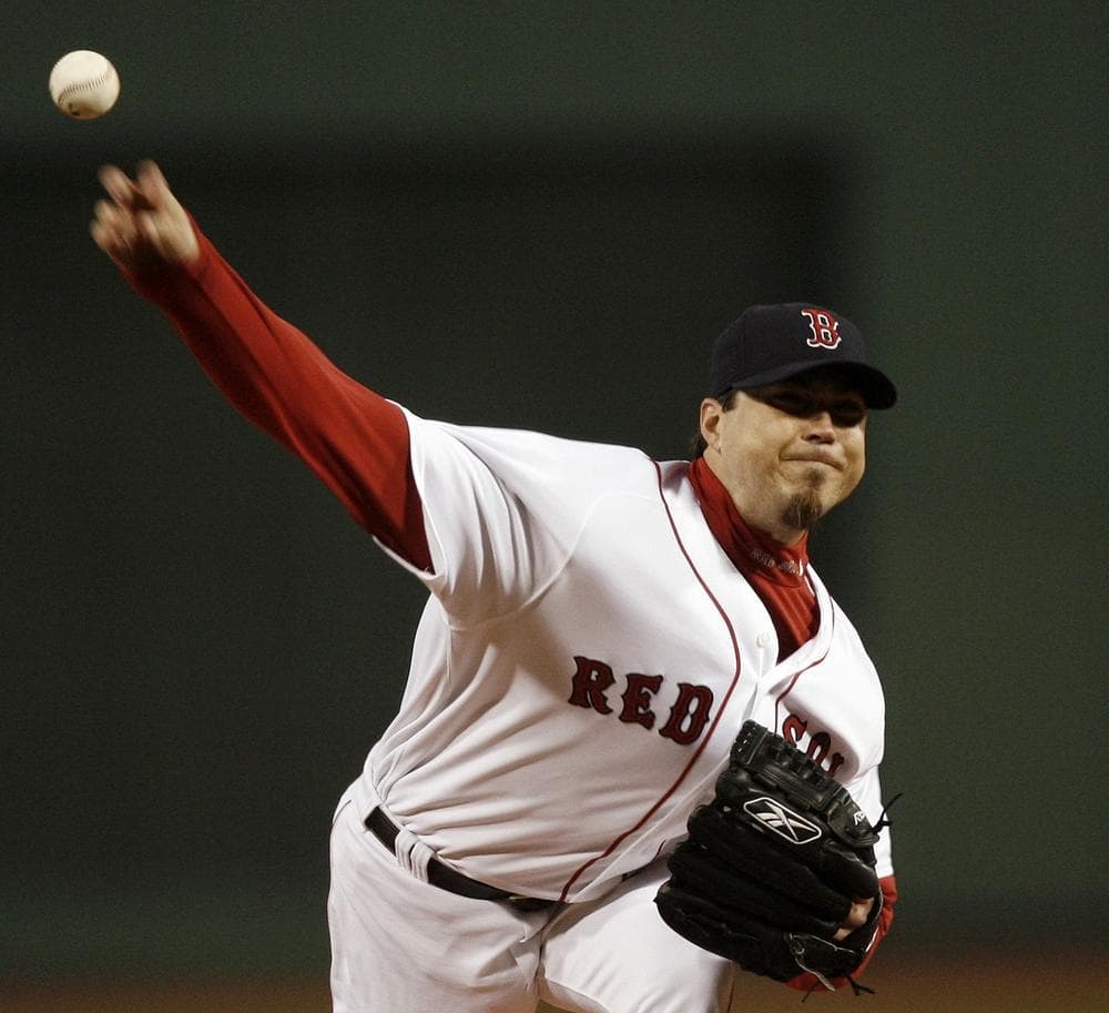 Josh Becket delivers a pitch against the New York Yankees at Fenway Park in 2007. (AP Photo/Winslow Townson)