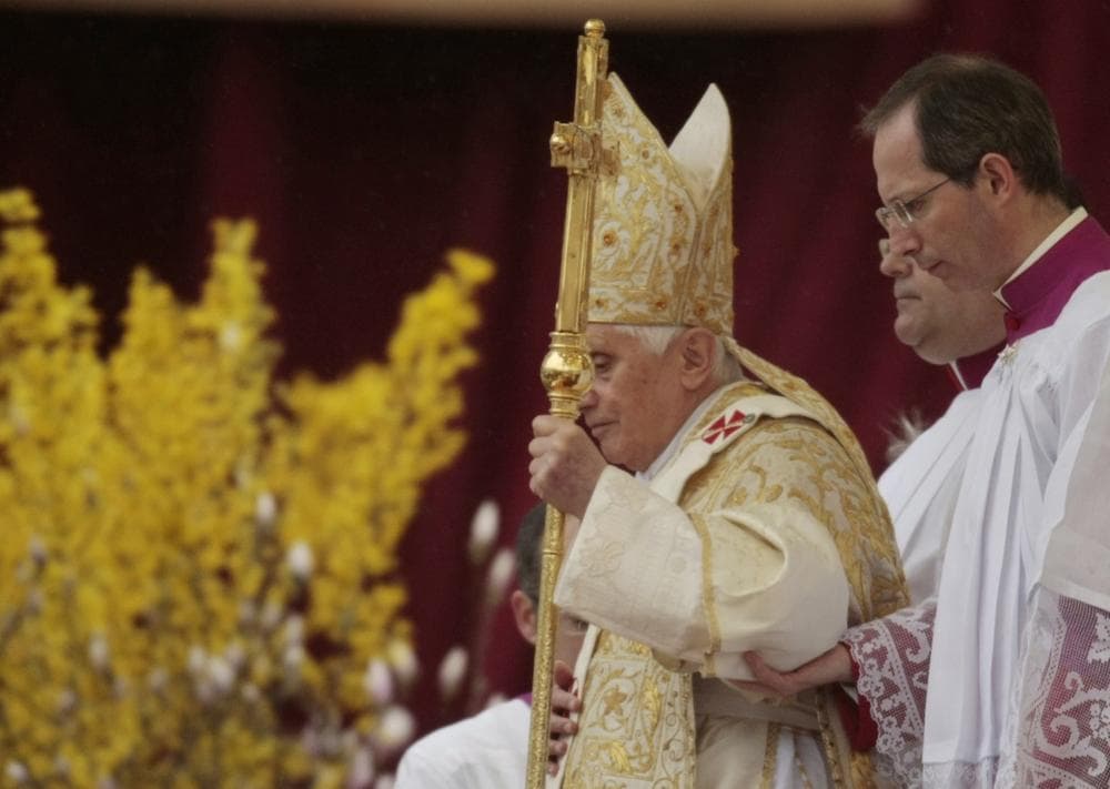 Pope Benedict XVI, left, flanked by Master of ceremonies Bishop Guido Marini arrives in St. Peter's square to celebrate the Easter Mass, at the Vatican, Sunday. (AP Photo/Gregorio Borgia)