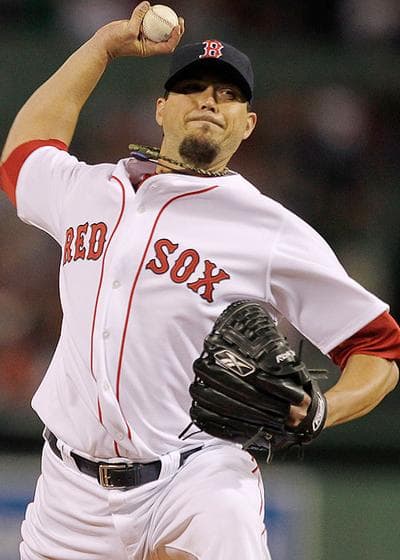 Though Boston Red Sox starting pitcher Josh Beckett struggled in his first outing Sunday, the organization gave him a big contract extension Monday. (AP)