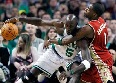 Boston Celtics' Kevin Garnett keeps the ball away from Cleveland Cavaliers' Antawn Jamison in the first quarter of an NBA basketball game on Sunday in Boston. (AP)