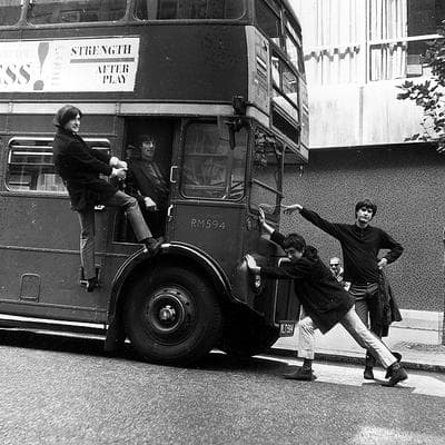 The Kinks joke around with a double-decker bus on a London street on Sept. 7, 1964. (AP) (Click to enlarge)