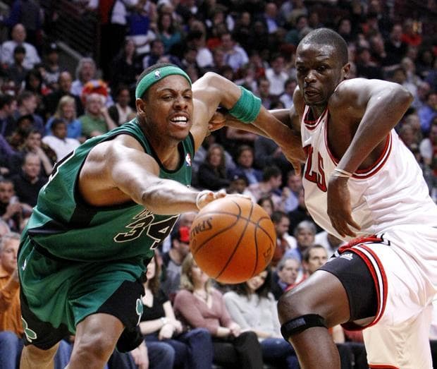Boston forward Paul Pierce tries to retain control of the ball as Chicago forward Luol Deng pursues during the third quarter of the game on Tuesday in Chicago. (AP)