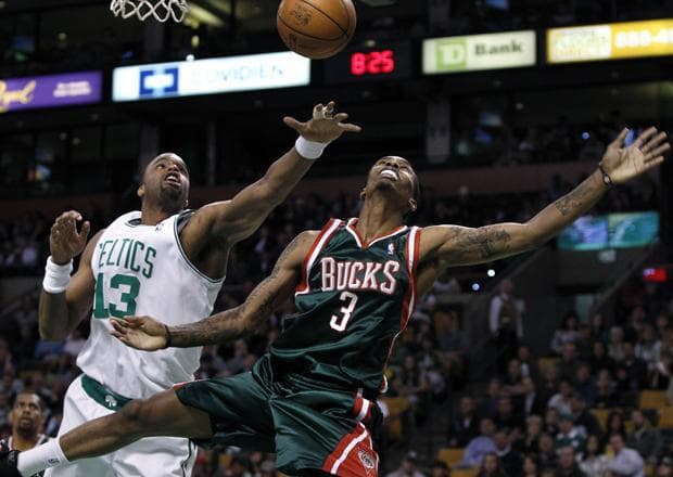 Boston forward Shelden Williams knocks the ball loose from Milwaukee guard Brandon Jennings as he drives during the first quarter of the game in Boston on Wednesday. (AP)