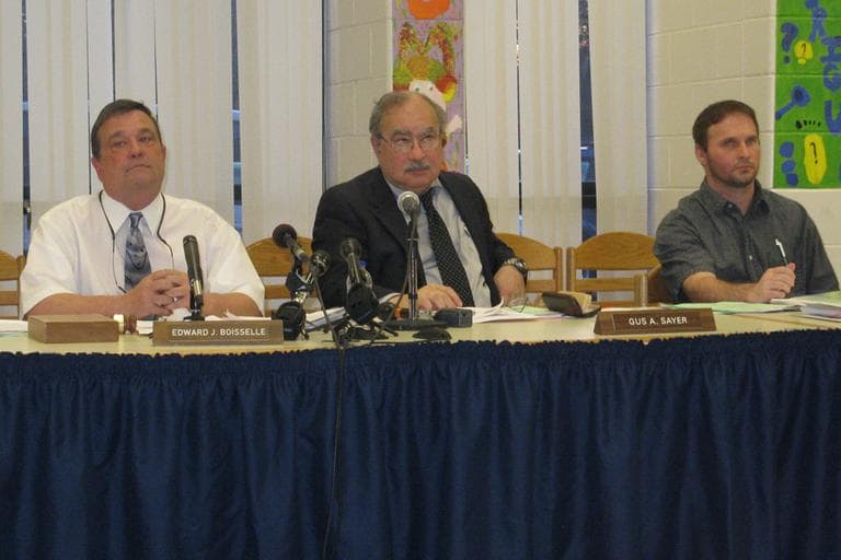 Superintendent of South Hadley Public Schools Gus Sayer, center, and school committee chairman Ed Boiselle, left, at Wednesday night&#39;s public meeting in South Hadley. (Deborah Becker/WBUR)
