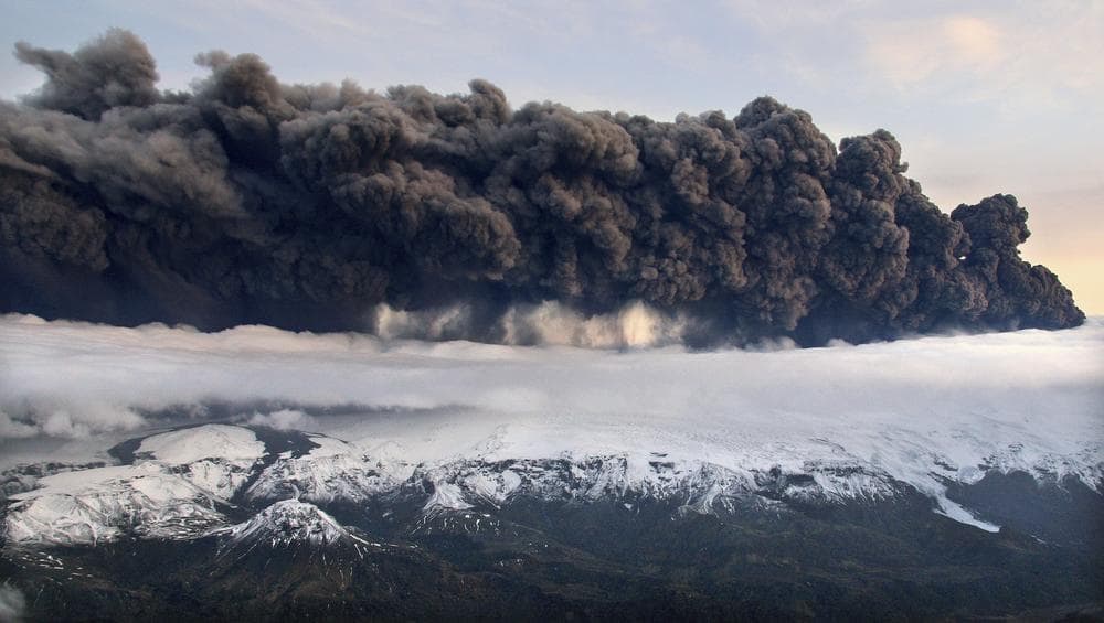 Smoke and steam hung over the volcano under the Eyjafjallajokull glacier in Iceland, which erupted for the second time in less than a month on Wednesday and disrupted worldwide traffic. (AP)