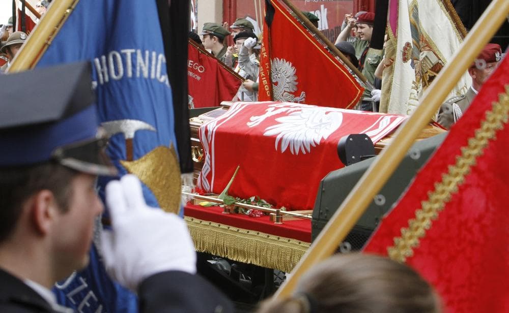 People salute in front of the coffin of late Polish President Lech Kaczynski on Sunday. (AP Photo/Ferdinand Ostrop) 