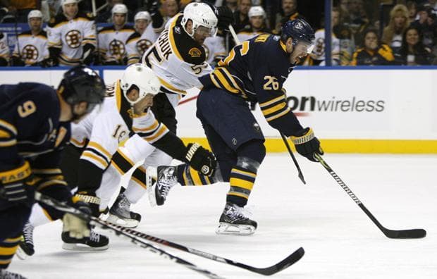 Buffalo's Thomas Vanek is hooked by Boston's Johnny Boychuk during the first period of a first-round NHL playoff hockey game in Buffalo, N.Y. on Saturday. Vanek was injured in the play. Boston won 5-3. (AP)