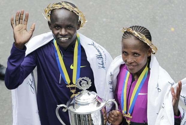 Boston Marathon winners Robert Cheruiyot of Kenya and Teyba Erkesso of Ethiopia pose together near the finish line after the 114th running of the Boston Marathon in Boston on Monday. (AP)