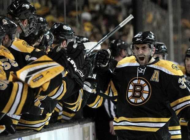 Boston center Patrice Bergeron celebrates his goal as he skates back to the bench during the third period of Game 3 against Buffalo in the playoff series in Boston on Monday. (AP)