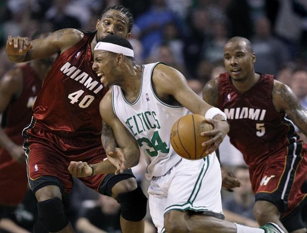 Boston forward Paul Pierce drives on Miami forward Udonis Haslem and guard Quentin Richardson during the second quarter of Game 2 in a first-round of the playoff series in Boston on Tuesday. (AP)