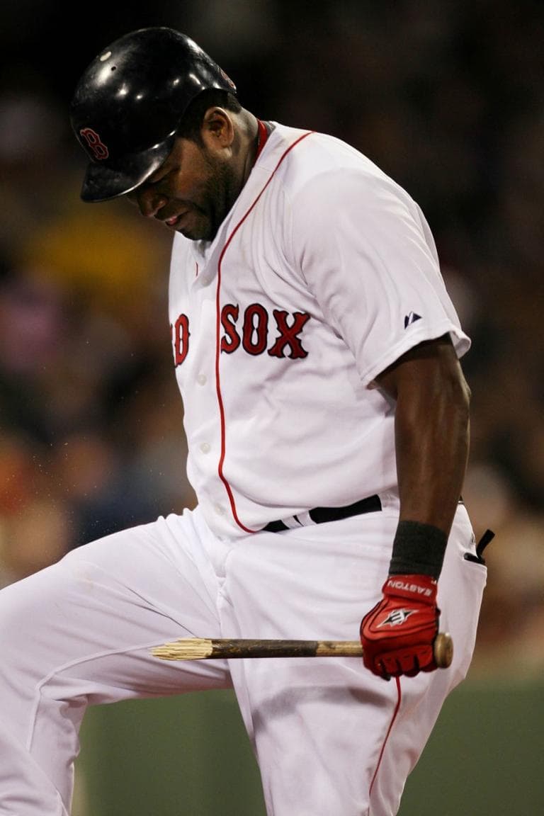 Boston&#39;s David Ortiz breaks his bat over his knee after fouling out against the Texas Rangers on Tuesday. (AP)