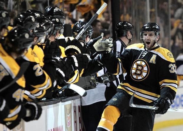 Boston center Patrice Bergeron celebrates his goal against Buffalo as he skates back to the bench during the third period of Game 4 of the first-round playoff series in Boston on Wednesday. (AP)