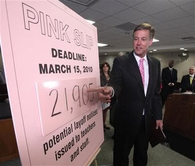 California schools chief Jack O'Connell gestures to a sign indicating that nearly 22,000 teachers could potentially be receiving layoff notices due to budgets cuts, Monday,  March 15, 2010. (AP)