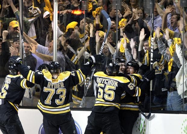 Boston celebrates winning Game 4 of the playoff series on Wednesday. The Bruins won 3-2. (AP Photo)