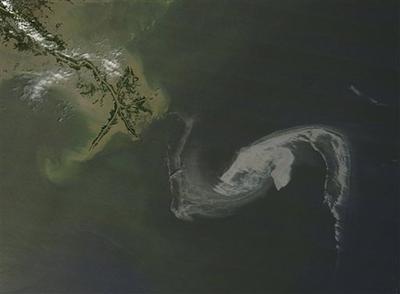 This NASA satellite photo made Thursday, April 29, 2010 shows the oil slick in the Gulf of Mexico as it closes in on the Pass a Loutre area of Plaquemines Parish, La. (AP/NASA)