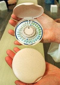 A birth control pill container designed to look like a makeup compact. (AP)