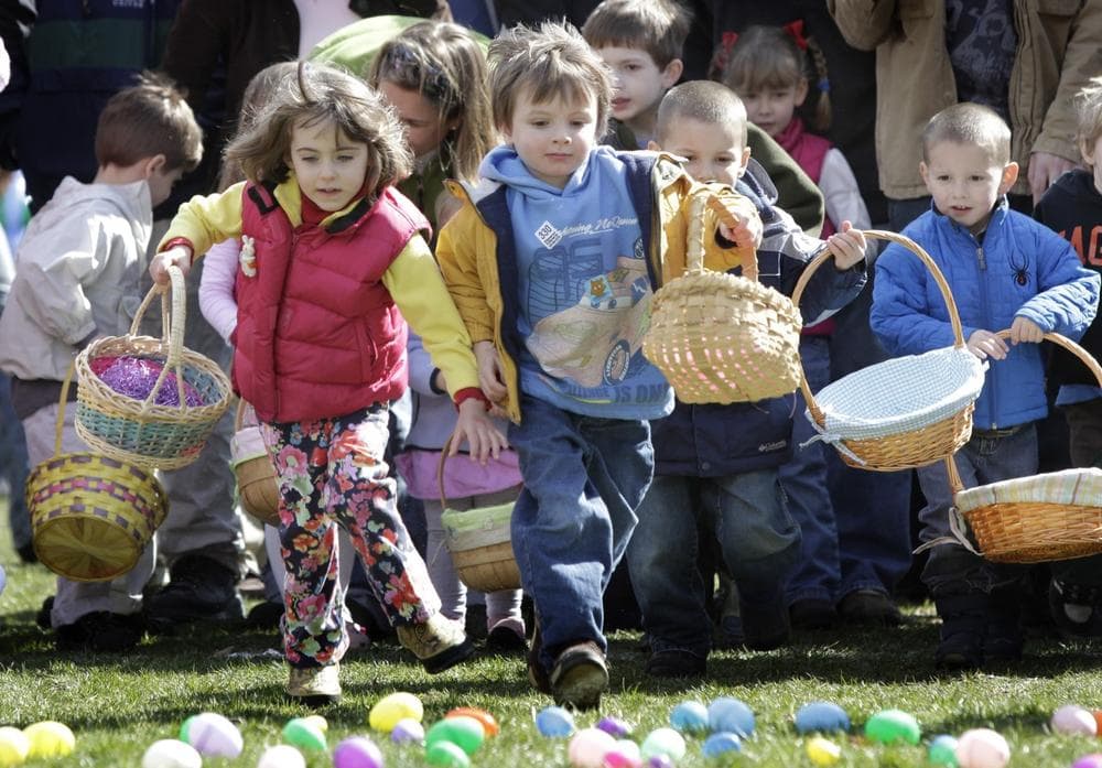 Baskets in hand, children run to collect plastic eggs during the annual Easter egg hunt in 2009. (AP)
