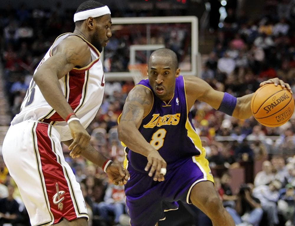 Los Angeles Lakers&#039; guard Kobe Bryant (8) drives against Cleveland&#039;s LeBron James. (AP Photo)