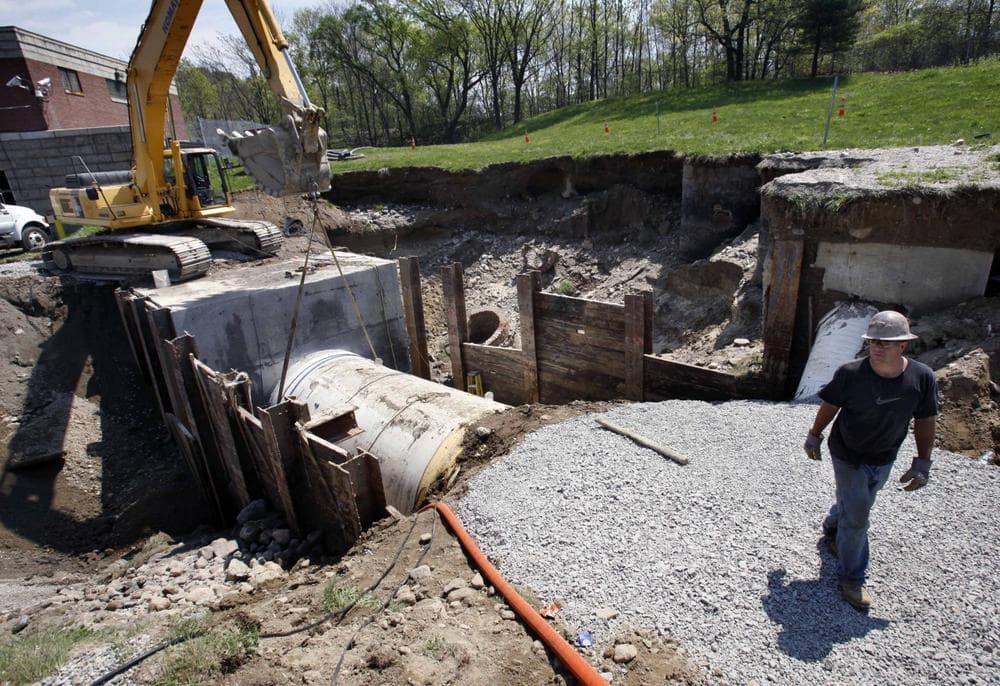 Repairs progressed Sunday in Weston, Mass. on a water main that failed on Saturday, sending millions of gallons of water into the Charles River and prompting Gov. Deval Patrick to issue an order for area residents to boil their tap water. (AP)