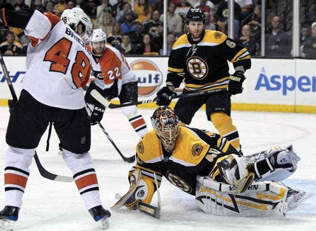 Boston goalie Tuukka Rask makes a pad save as Philadelphia center Danny Briere looks for a rebound during the first period of Game 2 of a second-round playoff series in Boston on Monday. (AP)