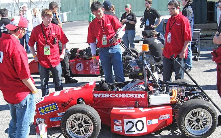The University of Wisconsin team waits its turn during the morning’s acceleration runs. (Doug Tribou/WBUR)