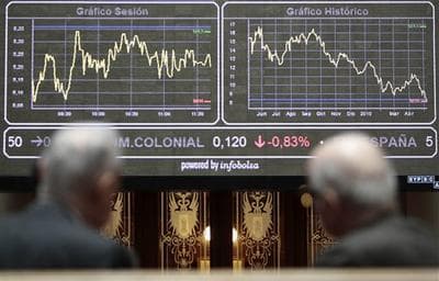 Traders look at a screen at Madrid&#039;s Stock Exchange. (AP)