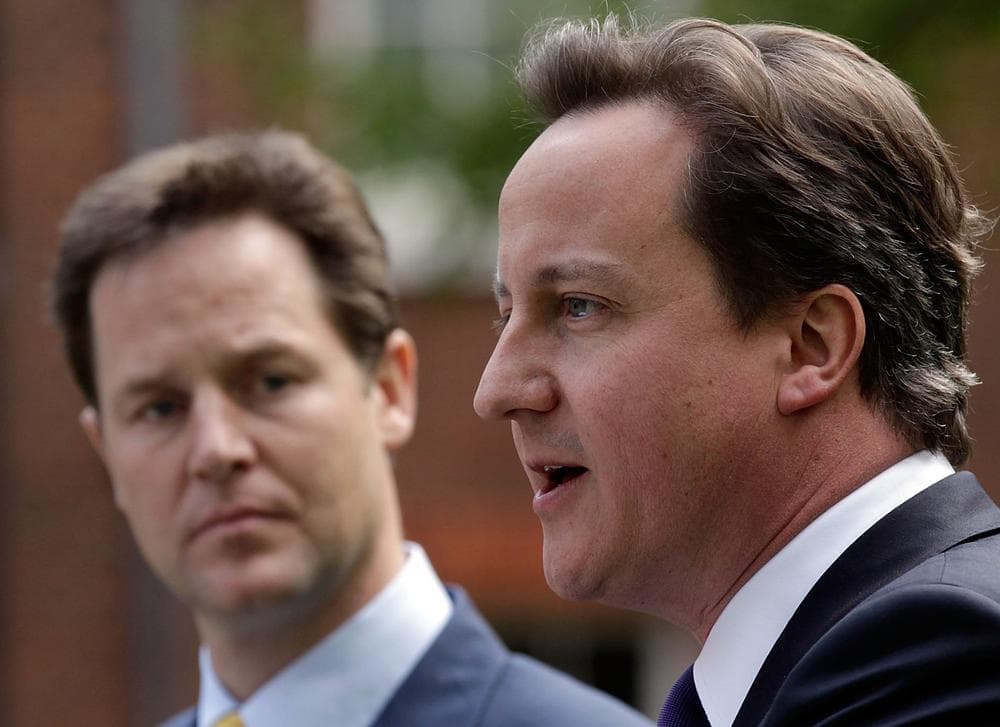 New British Prime Minister David Cameron, right, and Deputy Prime Minister Nick Clegg hold their first joint press conference in the garden of 10 Downing Street in London. (AP)
