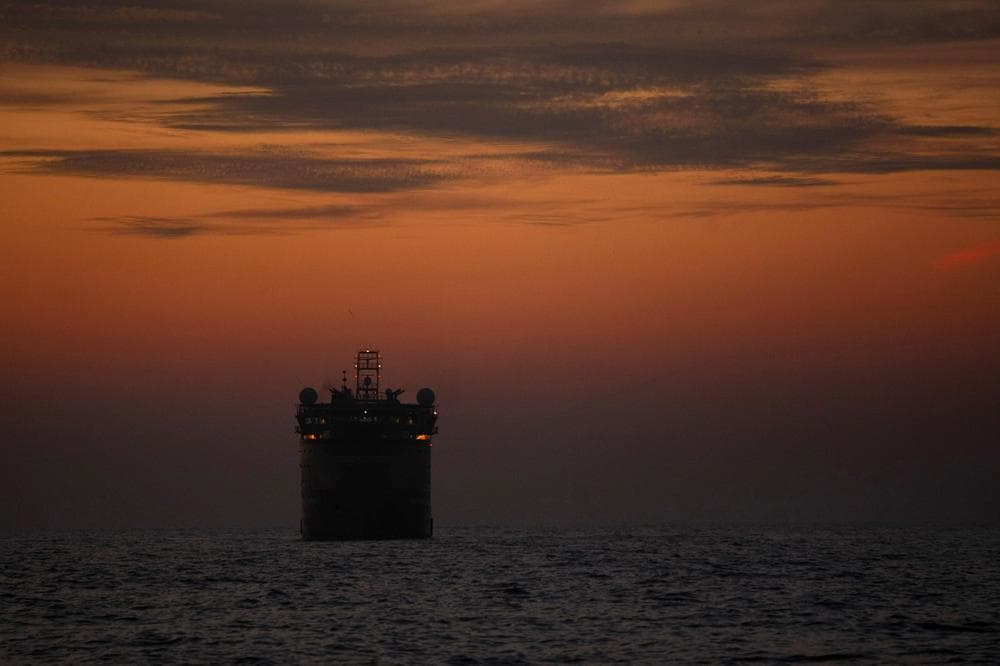 The Viking Poseidon, which is carrying the second containment device to be lowered to the sea floor, sits at sunset before deploying the device at the site of the Deepwater Horizon oil spill in the Gulf of Mexico.  (AP)