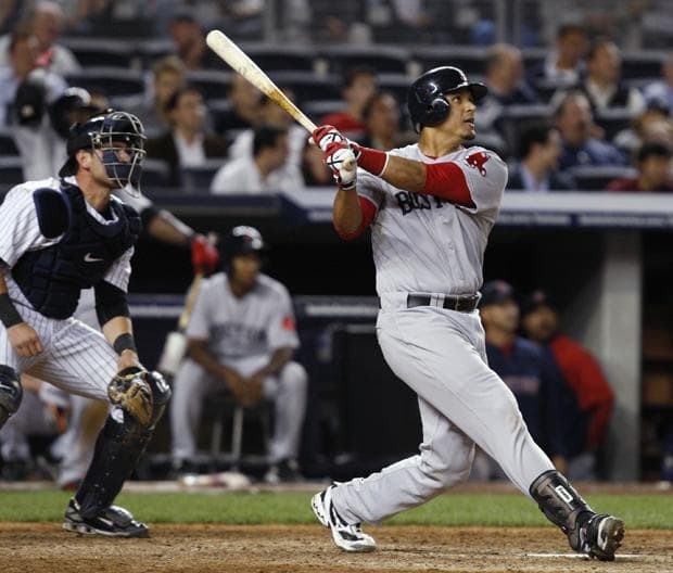 New York catcher Francisco Cervelli watches as Boston's Victor Martinez follows through on his eighth-inning solo home run in a game at Yankee Stadium in New York on Monday. (AP)