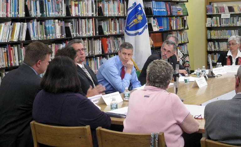 U.S. Education Secretary Arne Duncan (blue shirt) meets with state education officials at the Paul Revere School in Revere on Wednesday. (Deborah Becker/WBUR)