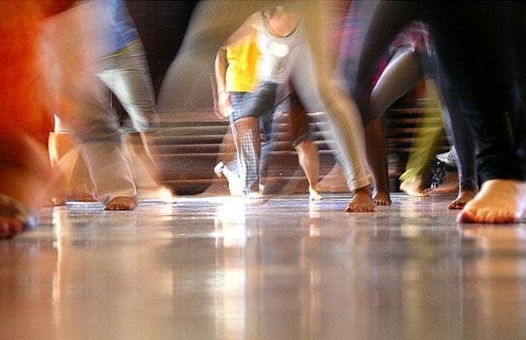 Feet move fast at Appolon&#39;s dance class. (Chris Burrell for WBUR)