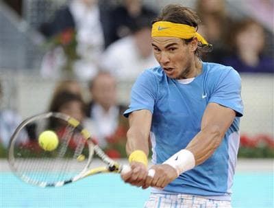 Rafael Nadal beats Roger Federer at the Madrid Open, May 16, 2010. (AP)